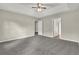 Bright bedroom featuring grey carpet and multiple doors at 3029 Oakvale Hts, Decatur, GA 30034