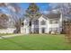 Two-story house with white siding, two-car garage, and a landscaped lawn at 3029 Oakvale Hts, Decatur, GA 30034