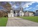 Two-story house with white siding, two-car garage, and a well-manicured lawn at 3029 Oakvale Hts, Decatur, GA 30034