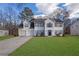 Two-story house with white siding, two-car garage, and a well-manicured lawn at 3029 Oakvale Hts, Decatur, GA 30034