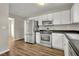 Modern kitchen with stainless steel appliances and white cabinets at 3029 Oakvale Hts, Decatur, GA 30034