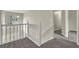 Upstairs hallway with carpet and white railing at 3029 Oakvale Hts, Decatur, GA 30034