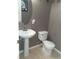 Small bathroom with pedestal sink and toilet at 3363 Fernview Dr, Lawrenceville, GA 30044