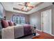 Primary bedroom with hardwood floors and ceiling fan at 3363 Fernview Dr, Lawrenceville, GA 30044