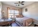 Bright bedroom with a double bed, desk and window at 3363 Fernview Dr, Lawrenceville, GA 30044