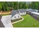 Aerial view of a charming ranch home with a large backyard and private driveway at 514 Dogwood Cir, Norcross, GA 30071