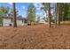 Spacious backyard with a deck and wooded backdrop at 514 Dogwood Cir, Norcross, GA 30071