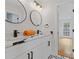 Double vanity bathroom with marble countertops and black accents at 514 Dogwood Cir, Norcross, GA 30071