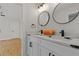 Updated bathroom with double vanity, marble countertops, and black matte fixtures at 514 Dogwood Cir, Norcross, GA 30071