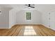 Bright bedroom with hardwood floors and window at 514 Dogwood Cir, Norcross, GA 30071