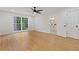 Bright bedroom with hardwood floors, large windows, and ensuite bathroom access at 514 Dogwood Cir, Norcross, GA 30071