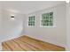 Bedroom with hardwood floors and two windows at 514 Dogwood Cir, Norcross, GA 30071