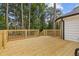 Wooden deck overlooks a wooded backyard, perfect for outdoor entertaining at 514 Dogwood Cir, Norcross, GA 30071