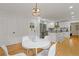 Bright dining area with white table and chairs, kitchen view at 514 Dogwood Cir, Norcross, GA 30071