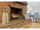 Brick fireplace with wood mantle, creating a cozy atmosphere at 514 Dogwood Cir, Norcross, GA 30071