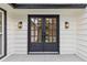 Stylish double front doors with black finish and glass panes at 514 Dogwood Cir, Norcross, GA 30071