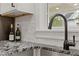 Close up of kitchen sink and faucet with granite counter at 514 Dogwood Cir, Norcross, GA 30071