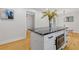 Modern kitchen island with white cabinets and granite countertop at 514 Dogwood Cir, Norcross, GA 30071