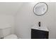 Modern powder room with pedestal sink and black fixtures at 514 Dogwood Cir, Norcross, GA 30071