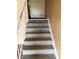 Carpeted staircase leading to the upper level at 6354 Shannon Pkwy # 30D, Union City, GA 30291