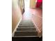 Carpeted stairs leading to the upper level at 6354 Shannon Pkwy # 30D, Union City, GA 30291