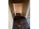 Indoor stairs with dark brown laminate flooring at 6354 Shannon Pkwy # 30D, Union City, GA 30291