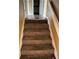 Carpeted staircase leading to upper level at 6354 Shannon Pkwy # 30D, Union City, GA 30291