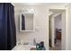 Bathroom featuring tile floors, bright lighting, and a vanity with a sink at 7034 Capps Ferry Rd, Douglasville, GA 30135