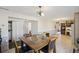 Dining area with a table and chairs, tile flooring, and access to the kitchen at 7034 Capps Ferry Rd, Douglasville, GA 30135