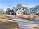 Long driveway leading to a two-story home at 3735 Tamiami Trl, Cumming, GA 30041