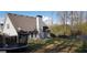 Spacious fenced backyard featuring a trampoline and ample room for outdoor activities and enjoyment at 520 Millbrook Village Dr, Tyrone, GA 30290