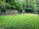 Fenced backyard with grassy area at 520 Millbrook Village Dr, Tyrone, GA 30290