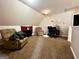 Cozy bedroom area featuring plush armchairs, comfortable carpeting, and a functional workspace with desk and chair at 520 Millbrook Village Dr, Tyrone, GA 30290