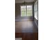 Bright dining area featuring tile floors and large windows offering serene views of the surrounding landscape at 520 Millbrook Village Dr, Tyrone, GA 30290
