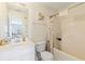 Well-lit bathroom with a shower/tub combo, toilet, and a vanity with a sink and decorative elements at 6834 Fireside Ln, South Fulton, GA 30349