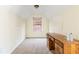 Neutral toned bedroom featuring a wooden desk, carpeted floors, natural light and sloped ceilings at 6834 Fireside Ln, South Fulton, GA 30349