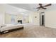 Expansive bedroom showcasing a fireplace, large windows, carpet flooring and natural light at 6834 Fireside Ln, South Fulton, GA 30349