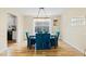 Dining room with hardwood floors, elegant lighting, and comfortable seating at 6834 Fireside Ln, South Fulton, GA 30349