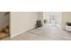 Cozy living area with light wood flooring and convenient access to both the staircase and another living area at 6834 Fireside Ln, South Fulton, GA 30349