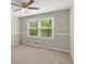 Bedroom featuring neutral walls, carpet, and a double window at 855 Riverbend Sw Dr, Lilburn, GA 30047
