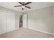 Bedroom with a ceiling fan, a large window, and a closet at 855 Riverbend Sw Dr, Lilburn, GA 30047