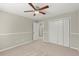 Bedroom featuring neutral walls, carpet, and a double closet at 855 Riverbend Sw Dr, Lilburn, GA 30047