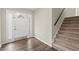 Inviting entryway with hardwood floors, front door with sidelights, and staircase at 855 Riverbend Sw Dr, Lilburn, GA 30047
