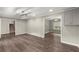 Open-concept living space with wood floors and neutral wall colors at 855 Riverbend Sw Dr, Lilburn, GA 30047