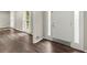 Open living room with stylish flooring, ample natural light, and neutral paint at 855 Riverbend Sw Dr, Lilburn, GA 30047