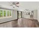 Open-concept living room boasts hardwood floors and plenty of natural light at 855 Riverbend Sw Dr, Lilburn, GA 30047