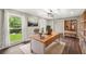 Bright office features hardwood floors, large window with backyard view, and custom built-in shelving at 855 Riverbend Sw Dr, Lilburn, GA 30047