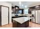 Modern kitchen with stainless steel appliances and granite island at 992 Belfry Ter, Fairburn, GA 30213