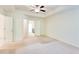 Large main bedroom featuring a ceiling fan and carpeted floors at 992 Belfry Ter, Fairburn, GA 30213