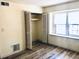 Bedroom with hardwood floors, closet, and large window at 134 Amherst Nw Pl, Atlanta, GA 30327